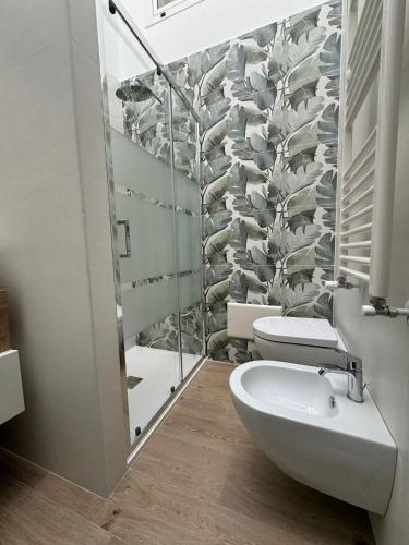 a bathroom with a toilet and a sink in it at Sweet home-Casa Di Bari in Turi