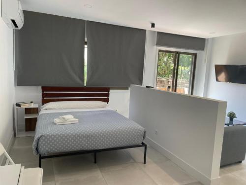 Ένα ή περισσότερα κρεβάτια σε δωμάτιο στο C5 Apartamento lujo, zona exclusiva de Chamartín