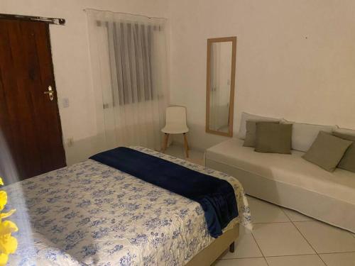 Postel nebo postele na pokoji v ubytování Suíte São Benedito