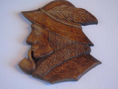 a wooden carving of a person wearing a hat at Villa-Bajka in Wisła
