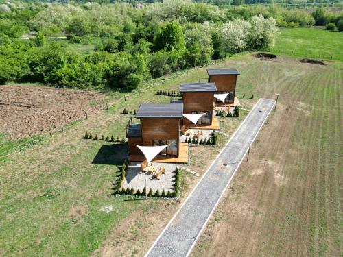 an overhead view of a house on a field at Natura Bungalow in Ždrelo
