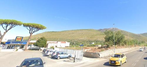 a bunch of cars parked in a parking lot at The Other House B&B in Formia