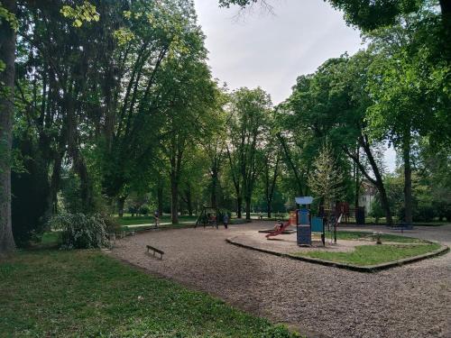 a park with a playground with people in it at Leier apartments in Piešťany