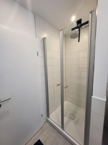 a shower with a glass door in a bathroom at Landliebe - b48899 in Stein