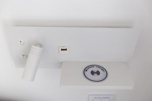 a bathroom with a white tub and a sink at Urban Loft in Porto