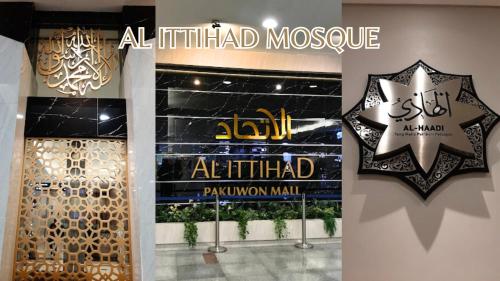 a store with a sign and a star on the wall at Le Tresor Benson Apartment at Supermal Pakuwon in Surabaya