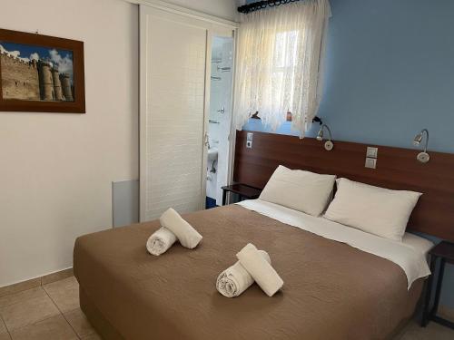 Ένα ή περισσότερα κρεβάτια σε δωμάτιο στο Eleni Rooms 