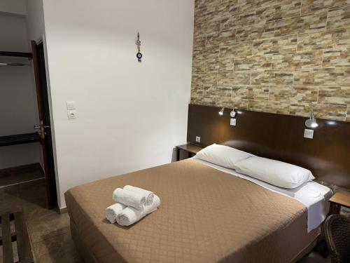 Ένα ή περισσότερα κρεβάτια σε δωμάτιο στο Eleni Rooms 