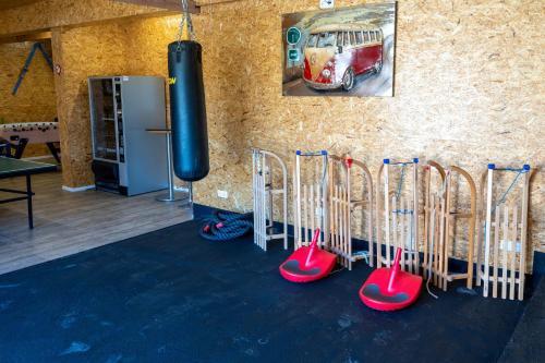 a group of golf clubs lined up against a wall at Wohnung-mit-Panoramablick in Buchenberg