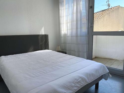 Postelja oz. postelje v sobi nastanitve Appartement Balaruc-les-Bains, 2 pièces, 2 personnes - FR-1-553-115