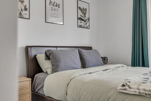 a bed in a bedroom with pictures on the wall at Initial / La Crête / MSA+pool in Beaupré