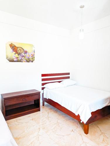 Ένα ή περισσότερα κρεβάτια σε δωμάτιο στο Casa Anastacia