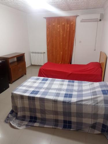 Ένα ή περισσότερα κρεβάτια σε δωμάτιο στο Appartement lumineux