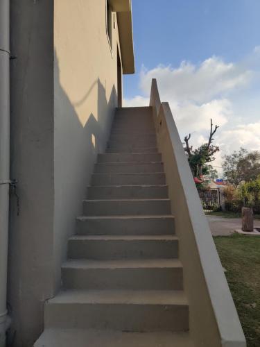 a stairway leading up to a building at Haven Guest House in Kodaikānāl