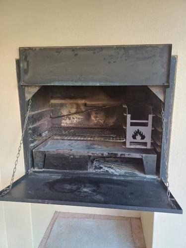 an old oven is chained to a wall at Leipoldt street 3 in Clanwilliam