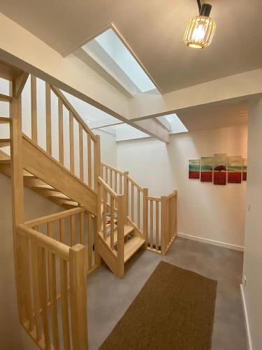 a hallway with stairs and a skylight in a house at Sympathique T3 cœur de village in Viuz-en-Sallaz