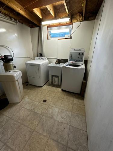 a small bathroom with two sinks and two toilets at Pocket Friendly Room-Plaza, bus stop walking distance!3 in Kitchener