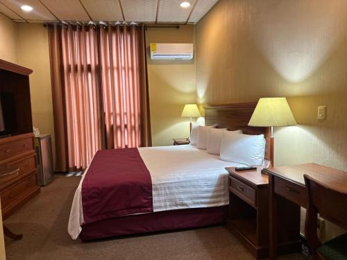 Un ou plusieurs lits dans un hébergement de l'établissement Hotel Reforma Tuxpan