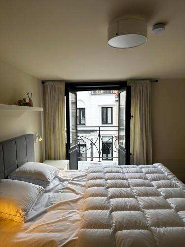 Giường trong phòng chung tại Villa Frans Luxe appartement 4 slpk