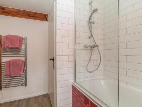 a bathroom with a shower and a bath tub at 36 High Street in Salisbury
