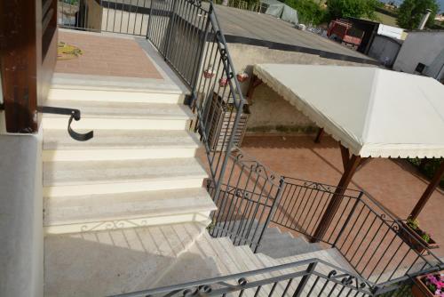an overhead view of a staircase with a white counter at Nonna Alda in Spoleto