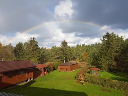 an overhead view of a rainbow in the sky at U MARTUŚKI DOMKI POKOJE POD LASEM in Stegna