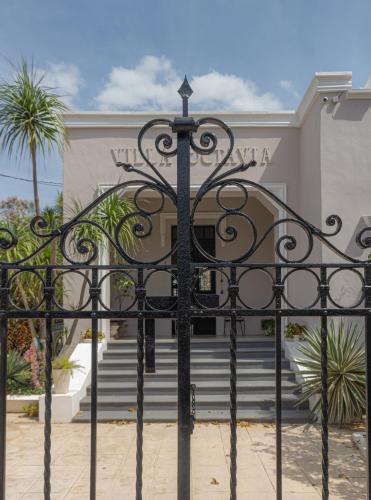 an iron gate in front of a building at Villa Octavia in Mérida
