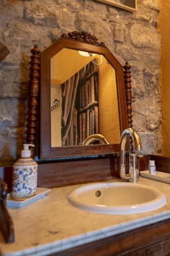 a bathroom sink with a mirror on a counter at La Bergerie du Haut Var in Bargème
