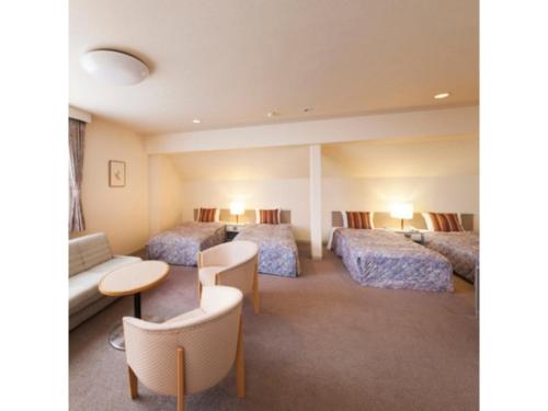 En eller flere senge i et værelse på Mount View Hotel - Vacation STAY 40138v