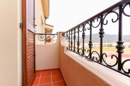 a balcony in a house with a view at B&B Ametista in Villasimius