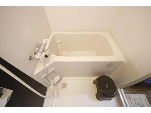 a small bathroom with a sink in a room at Chura Gahna House Tsubogawa - Vacation STAY 40171v in Naha