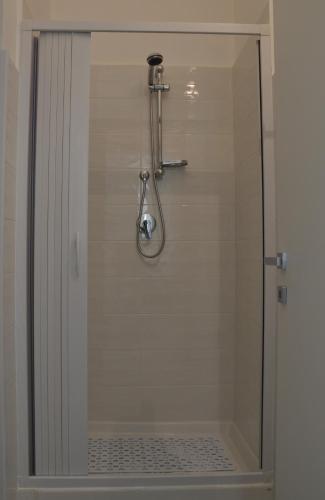a shower with a glass door in a bathroom at B&B La Meta in Benevento