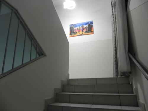a staircase in a building with a picture on the wall at De Bliss Lodge in Johannesburg