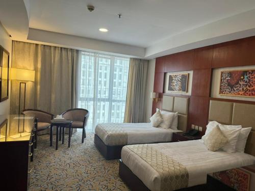 Un ou plusieurs lits dans un hébergement de l'établissement فندق الاء البيت