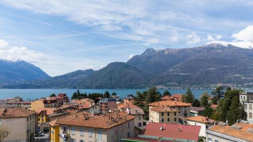 a view of a town with mountains and a lake at Cà del Lasco - Free parking apartments 5 min from the station in Bellano
