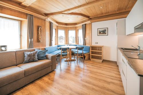 a living room with a couch and a table at Villa Aurelia in Ortisei