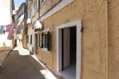 a building with a door on the side of a street at Lusso di Campiello in Corfu Town