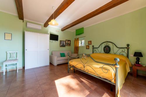 a bedroom with a bed and a living room at Il Tremolar Della Marina in Casalbordino