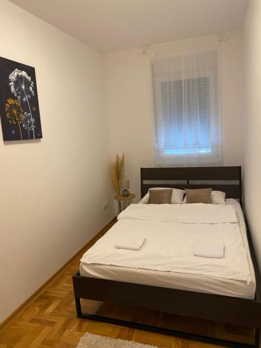 Postel nebo postele na pokoji v ubytování Anči apartmani