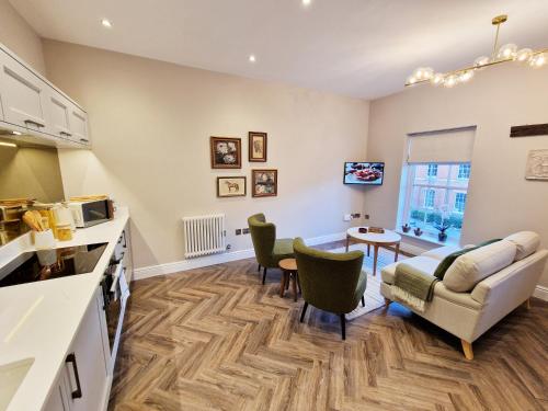 a living room with a couch and a table at Elevated Space Apartments, Shipston on Stour in Shipston on Stour