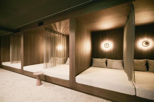 Postel nebo postele na pokoji v ubytování TRIFORÊT alpin resort