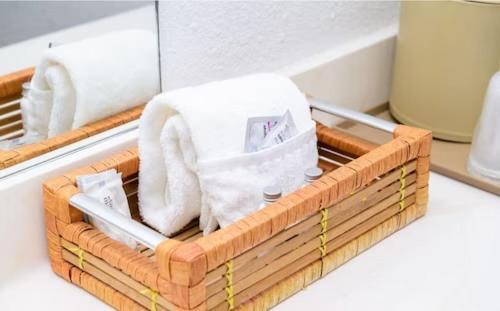 a wooden tray with towels and a towel at The Land O Nod in Eureka Springs