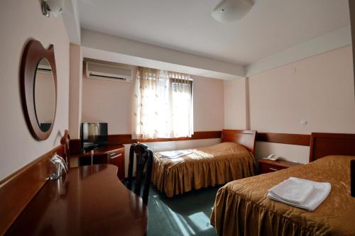 Postel nebo postele na pokoji v ubytování Hotel Cingo