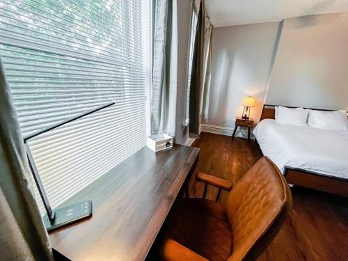 a small room with a bed and a window at Urban 1BR Nurse's Retreat Barnes & Children's in Tower Grove