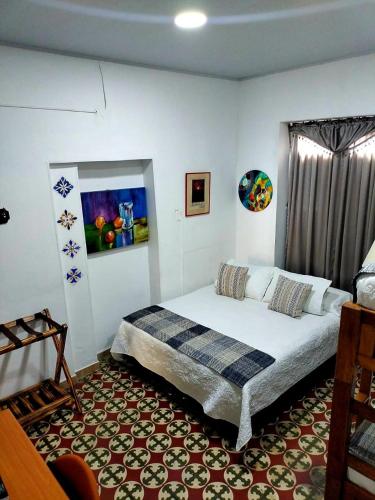 Ένα ή περισσότερα κρεβάτια σε δωμάτιο στο Hotel Posada Turística la Ceiba