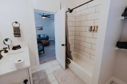 a bathroom with a shower and a sink at Luxe 2BR Oasis Patio & Laundry Soulard in Soulard