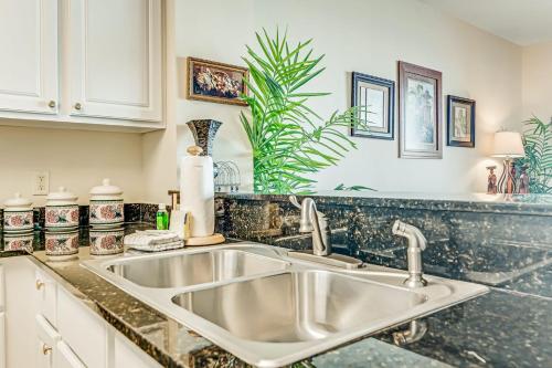 a kitchen with a sink and a counter top at Calypso Resort & Towers in Panama City Beach