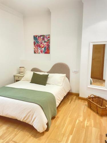 En eller flere senge i et værelse på Apartamento San Agustín- Centro