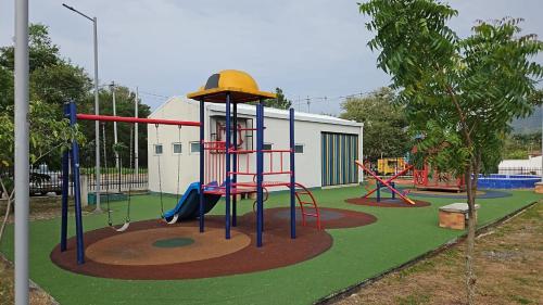 a playground with a slide in a park at Apartamento en Villeta 2 in Villeta