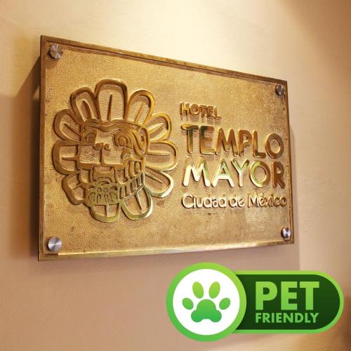 a sign on a wall with a scorpion on it at Hotel Templo Mayor in Mexico City
